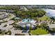 Aerial view of community pool, clubhouse, and amenities surrounded by lush landscaping and neighborhood homes at 3344 Anchor Bay Trl, Bradenton, FL 34211