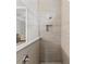 Shower boasts sleek tile design and an open glass enclosure, showcasing a contemporary aesthetic at 3344 Anchor Bay Trl, Bradenton, FL 34211