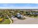 View of a street with immaculate landscaping and a neighborhood entrance in a vibrant community at 3344 Anchor Bay Trl, Bradenton, FL 34211