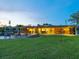 Expansive backyard with covered patio, pool and beautiful lawn at 355 Shore Dr, Ellenton, FL 34222