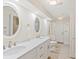 Bright bathroom featuring dual sinks, quartz counters, and updated fixtures at 355 Shore Dr, Ellenton, FL 34222