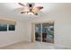The bedroom features a sliding glass door to an outdoor patio, creating a seamless indoor-outdoor living experience at 355 Shore Dr, Ellenton, FL 34222