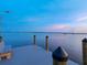 Stunning waterfront home features a private dock with picturesque sunset views at 355 Shore Dr, Ellenton, FL 34222