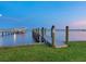 Private dock with boat lift overlooking peaceful bay waters and neighboring docks at 355 Shore Dr, Ellenton, FL 34222
