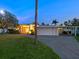 Home exterior with a covered parking area, spacious driveway, and manicured lawn creating a welcoming curb appeal at 355 Shore Dr, Ellenton, FL 34222