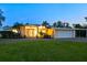 Charming home exterior featuring a well-manicured lawn, covered entrance, and attached garage, perfect for suburban living at 355 Shore Dr, Ellenton, FL 34222