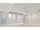 Large living area with a modern ceiling fan, recessed lighting, and access to the bathroom at 355 Shore Dr, Ellenton, FL 34222