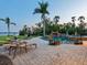 Resort-style pool area with waterfall feature, lush landscaping, and comfortable lounge chairs at 355 Shore Dr, Ellenton, FL 34222