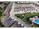Aerial view of home location in a well maintained neighborhood close to a pool and surrounded by green spaces at 3681 Divot Ln, Sarasota, FL 34232
