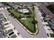 Aerial view of the neighborhood highlights the community pool, walking paths, and manicured lawns at 3681 Divot Ln, Sarasota, FL 34232