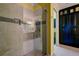 Elegant bathroom with glass shower, neutral tiles, and stylish fixtures at 3681 Divot Ln, Sarasota, FL 34232