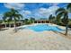 Relax and unwind at this beautiful community pool with a spacious deck and comfortable seating areas at 3681 Divot Ln, Sarasota, FL 34232