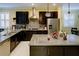 Well-equipped kitchen with granite counters, stainless appliances, and a functional layout, ideal for cooking at 3681 Divot Ln, Sarasota, FL 34232