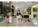 Spacious kitchen featuring granite countertops, stainless steel appliances, and seamless integration with the adjacent spaces at 3681 Divot Ln, Sarasota, FL 34232