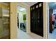 Well-equipped laundry room featuring modern washer and dryer units and built-in storage cabinets at 3681 Divot Ln, Sarasota, FL 34232