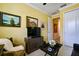 Comfortable living room featuring a TV and artwork, creating an inviting atmosphere at 3681 Divot Ln, Sarasota, FL 34232