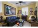 Cozy living room with a comfortable sofa, artwork, and natural light creating an inviting atmosphere at 3681 Divot Ln, Sarasota, FL 34232