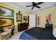 The spacious main bedroom has decor, furniture and multiple pieces of art at 3681 Divot Ln, Sarasota, FL 34232