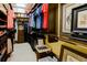 Spacious walk-in closet with custom shelving and hanging rods for organized storage and display at 3681 Divot Ln, Sarasota, FL 34232