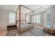 Primary bedroom featuring tray ceilings, natural light, stylish rug, and access to pool at 413 Partridge Cir, Sarasota, FL 34236