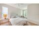 Bright bedroom with neutral tones and a large window offering plenty of natural light at 413 Partridge Cir, Sarasota, FL 34236