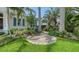Secluded outdoor seating area surrounded by lush landscaping on the property's grounds at 413 Partridge Cir, Sarasota, FL 34236