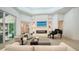 Beautiful living room with a fireplace, grand piano and lots of natural light at 413 Partridge Cir, Sarasota, FL 34236