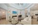 Elegant living room with fireplace, grand piano and lots of natural light at 413 Partridge Cir, Sarasota, FL 34236