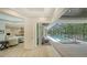 Spacious living room with a view and easy access to a covered pool and spa area at 413 Partridge Cir, Sarasota, FL 34236