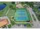 Aerial shot of well-maintained tennis courts in a golf course community at 4211 Caddie E Dr # 202, Bradenton, FL 34203