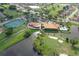 An aerial view of community amenities including a pool, tennis courts, and golf course surrounded by lush landscaping at 4211 Caddie E Dr # 202, Bradenton, FL 34203
