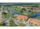 Panoramic aerial view of a golf course community with a pool and clubhouse at 4211 Caddie E Dr # 202, Bradenton, FL 34203