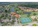 Expansive aerial view featuring the golf course, tennis courts, and surrounding residential area at 4211 Caddie E Dr # 202, Bradenton, FL 34203