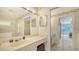 Well-lit bathroom with a vanity and an enclosed glass shower at 4211 Caddie E Dr # 202, Bradenton, FL 34203