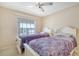 Cozy bedroom with two twin beds, natural light, and soothing color scheme at 4211 Caddie E Dr # 202, Bradenton, FL 34203
