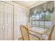 Inviting dining area featuring a table with seating for four, a window, and access to nearby storage at 4211 Caddie E Dr # 202, Bradenton, FL 34203