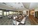 Well-lit dining space features tables with scenic outdoor views, ideal for a relaxed dining experience at 4211 Caddie E Dr # 202, Bradenton, FL 34203