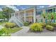 Charming condo building with well-maintained landscaping and inviting outdoor spaces, perfect for relaxed living at 4211 Caddie E Dr # 202, Bradenton, FL 34203