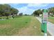 Beautiful golf course with vibrant green grass, mature trees, and serene lake views enhancing the landscape at 4211 Caddie E Dr # 202, Bradenton, FL 34203