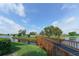 Scenic golf course view with a charming bridge over water, enhanced by lush greenery and blue skies at 4211 Caddie E Dr # 202, Bradenton, FL 34203