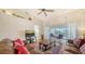 Vaulted ceiling living room with access to a screened lanai and stunning water views at 4211 Caddie E Dr # 202, Bradenton, FL 34203