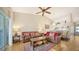 Spacious living area showcasing hardwood floors, comfortable seating and a ceiling fan at 4211 Caddie E Dr # 202, Bradenton, FL 34203