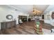 Spacious lobby with hardwood floors, decorative furnishings, and elegant chandeliers, creating an inviting atmosphere at 4211 Caddie E Dr # 202, Bradenton, FL 34203