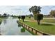 Picturesque pond featuring a fountain and lush landscaping, adding a touch of elegance to the community at 4211 Caddie E Dr # 202, Bradenton, FL 34203