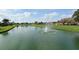 Expansive pond with a fountain, offering serene water views and enhancing the community's outdoor space at 4211 Caddie E Dr # 202, Bradenton, FL 34203