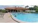 Large pool, lounge chairs and landscaping at 4211 Caddie E Dr # 202, Bradenton, FL 34203