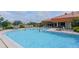Outdoor pool with lounge chairs at 4211 Caddie E Dr # 202, Bradenton, FL 34203