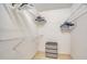 Walk-in closet equipped with shelves and clothing rods for maximum organization at 4211 Caddie E Dr # 202, Bradenton, FL 34203