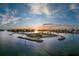 Sunset aerial view of a lush island landscape with coastal homes at 4232 Pandora Rd, Venice, FL 34293