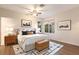 Inviting bedroom featuring a ceiling fan, natural light, and stylish decor at 4232 Pandora Rd, Venice, FL 34293